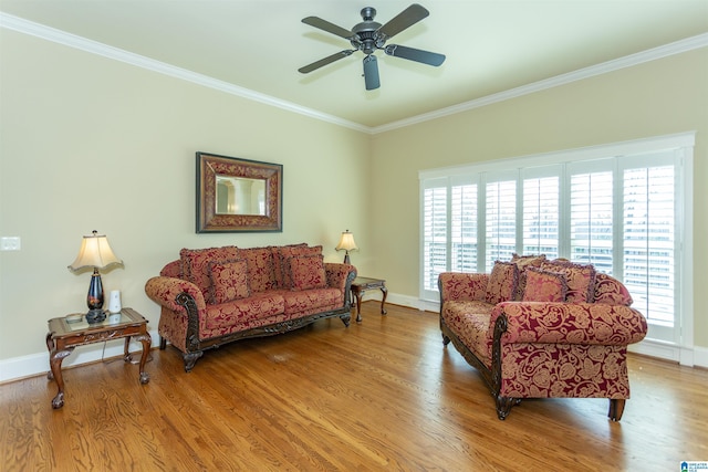 living room featuring hardwood / wood-style flooring, ornamental molding, and ceiling fan