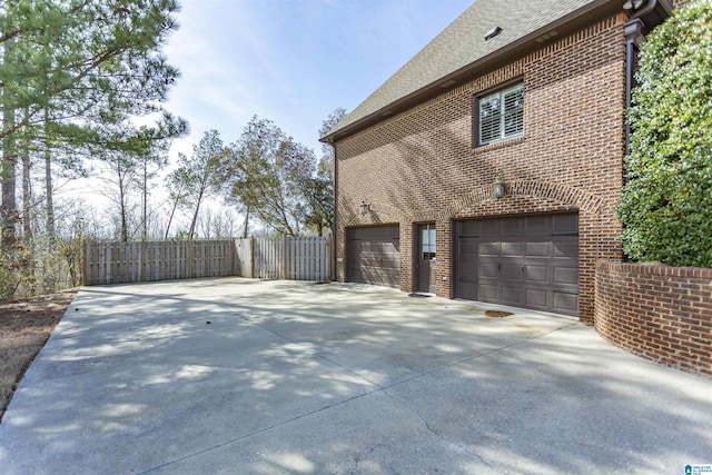 view of property exterior with a garage