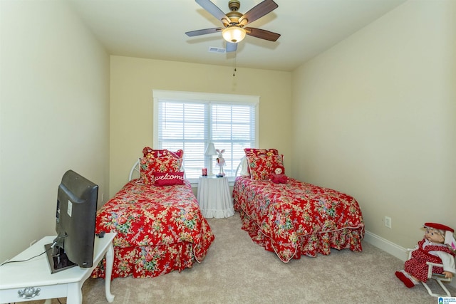 bedroom with ceiling fan and carpet floors