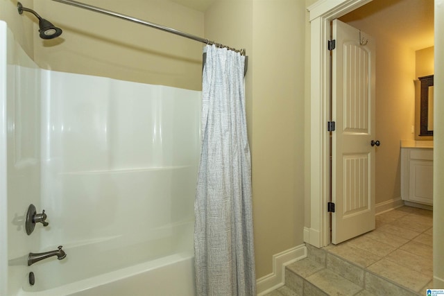 bathroom with tile patterned flooring, vanity, and shower / tub combo