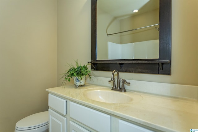 bathroom with vanity and toilet