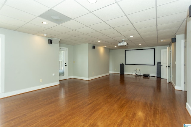 unfurnished room featuring a drop ceiling and dark hardwood / wood-style floors