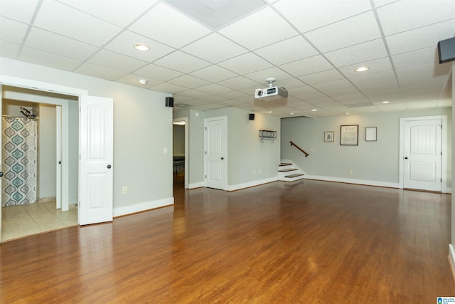 empty room featuring hardwood / wood-style floors and a paneled ceiling