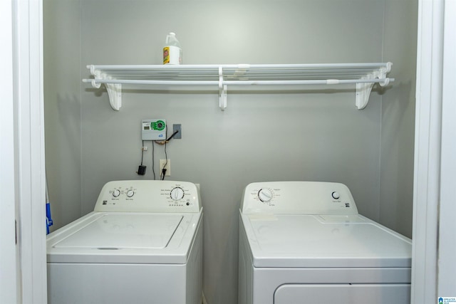 laundry room with independent washer and dryer