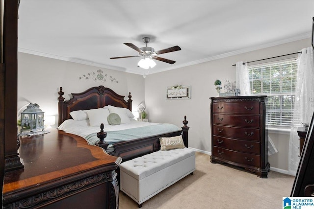 carpeted bedroom featuring ornamental molding and ceiling fan