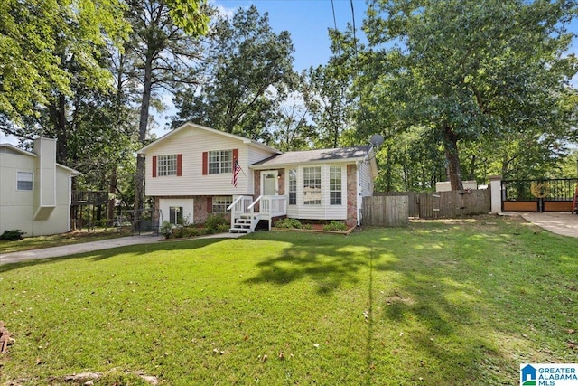 tri-level home with a front yard