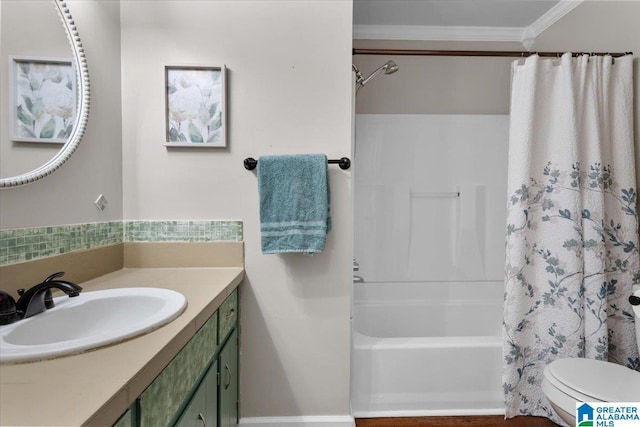 full bathroom featuring crown molding, shower / tub combo with curtain, vanity, and toilet