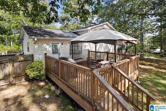 wooden terrace featuring a gazebo