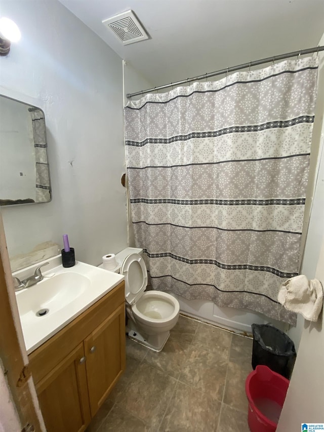 bathroom featuring tile patterned flooring, vanity, a shower with shower curtain, and toilet