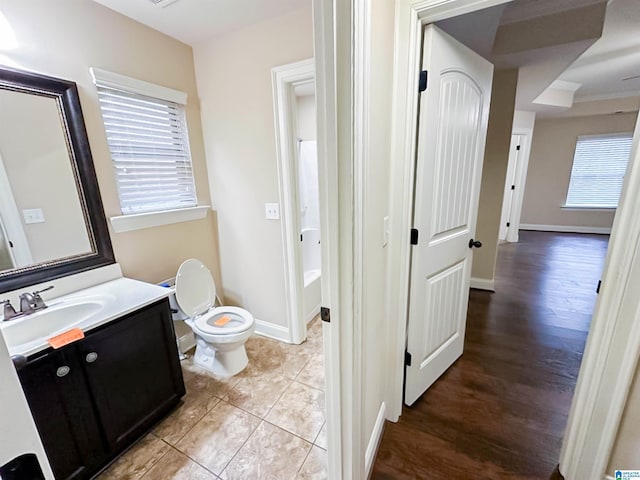 bathroom featuring vanity, tile patterned flooring, and toilet