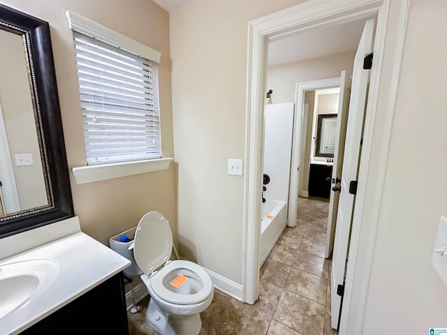 full bathroom featuring vanity, bathing tub / shower combination, tile patterned floors, and toilet