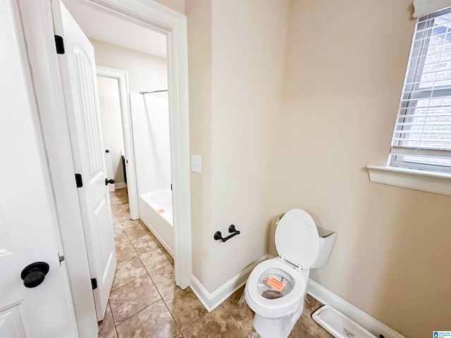 bathroom featuring tile patterned floors and toilet