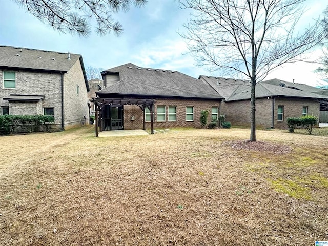 back of house featuring a yard and a patio area