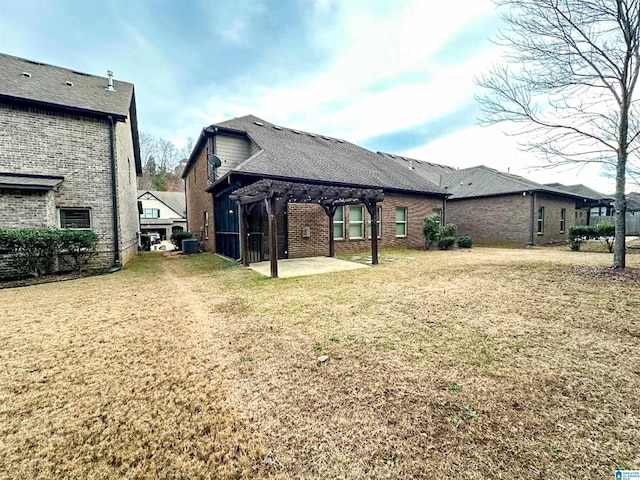 view of yard featuring cooling unit, a pergola, and a patio