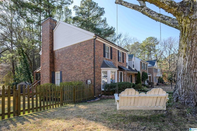 view of home's exterior featuring a lawn