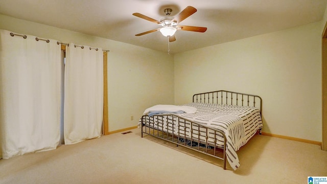 bedroom with ceiling fan and carpet