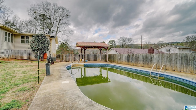 view of swimming pool featuring a gazebo, a lawn, and a patio