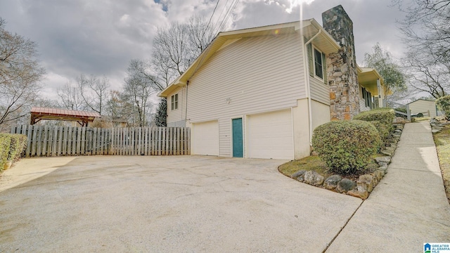 view of side of property with a garage