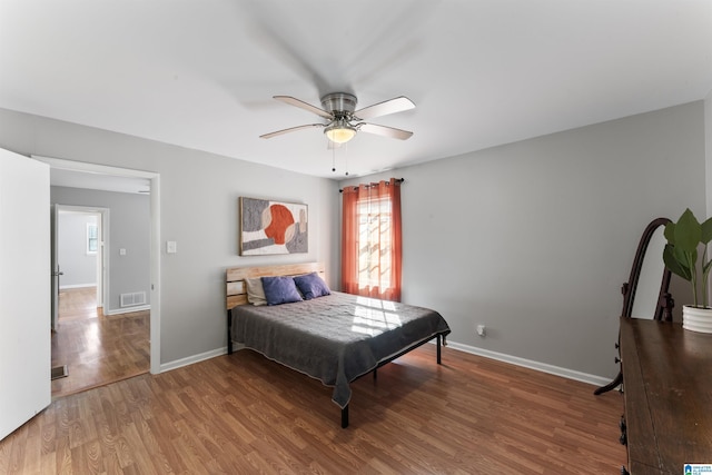 bedroom featuring wood-type flooring and ceiling fan