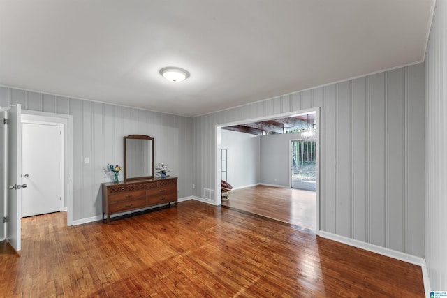 empty room with hardwood / wood-style flooring