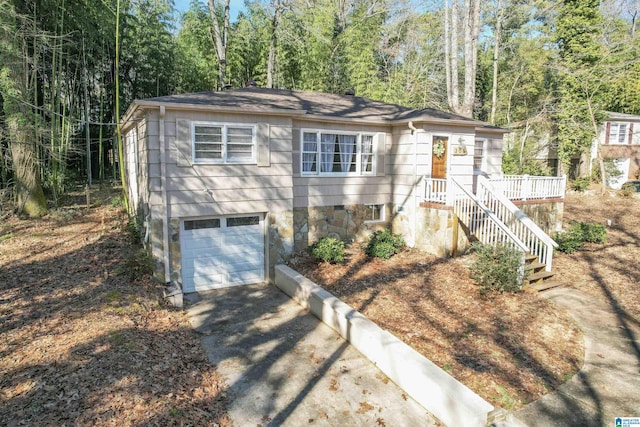 view of front of home featuring a garage and a deck