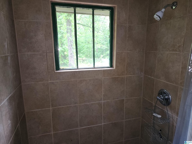 bathroom with tiled shower