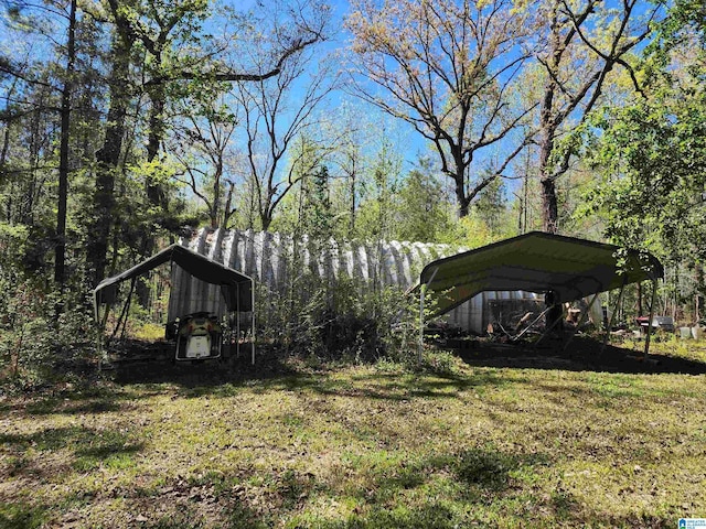 view of yard with a carport