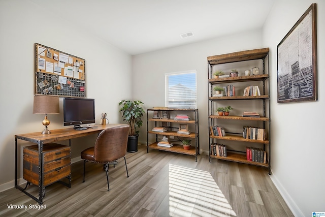 office area with hardwood / wood-style flooring