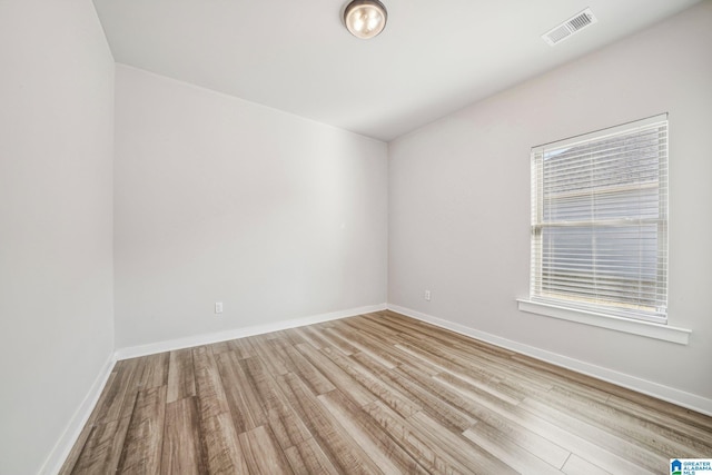 unfurnished room featuring light hardwood / wood-style flooring