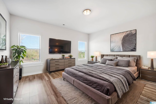 bedroom with light hardwood / wood-style floors