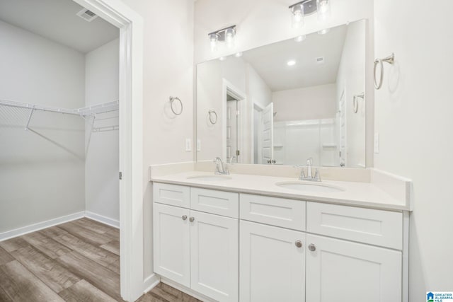 bathroom featuring wood-type flooring and vanity