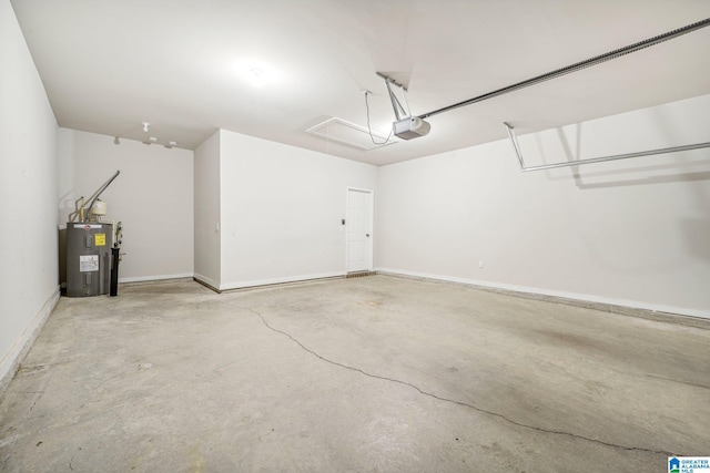 garage featuring a garage door opener and electric water heater