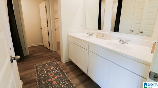 bathroom featuring vanity and hardwood / wood-style floors