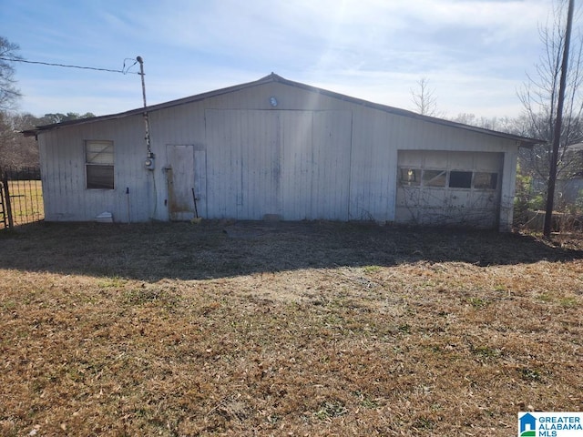 view of outdoor structure featuring a lawn