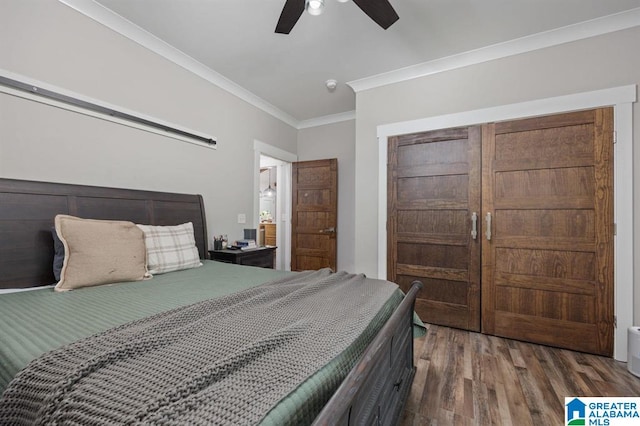 bedroom featuring ceiling fan, ornamental molding, and wood-type flooring