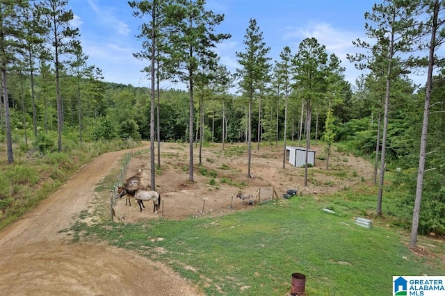 view of community with an outdoor structure