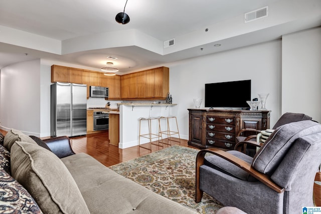 living room featuring dark hardwood / wood-style flooring