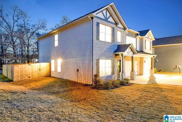 view of side of home featuring covered porch