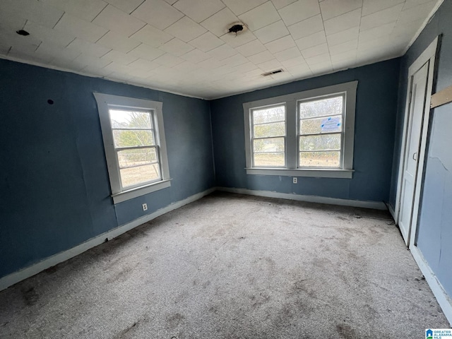 unfurnished room with light carpet