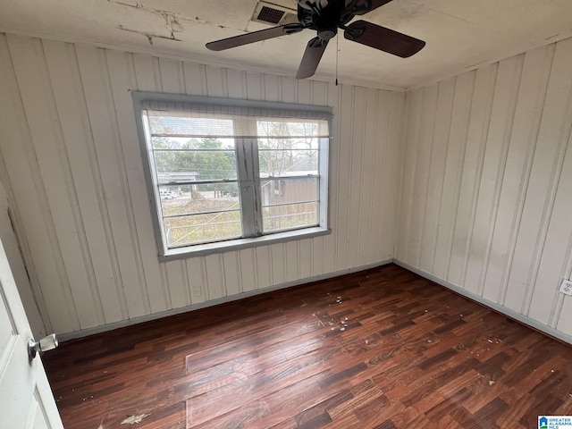 empty room with dark wood-type flooring