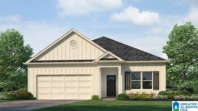 view of front of home with a garage and a front yard