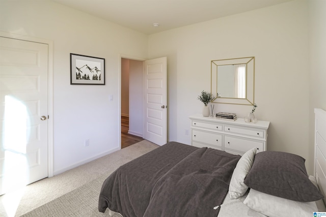 bedroom with light carpet