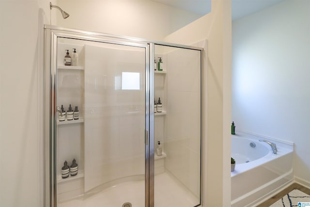 bathroom with separate shower and tub