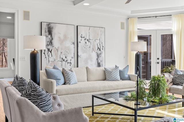 living room with crown molding and french doors