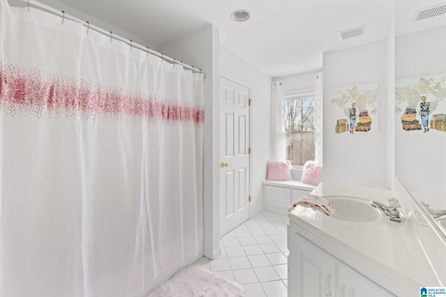 bathroom with vanity and tile patterned floors