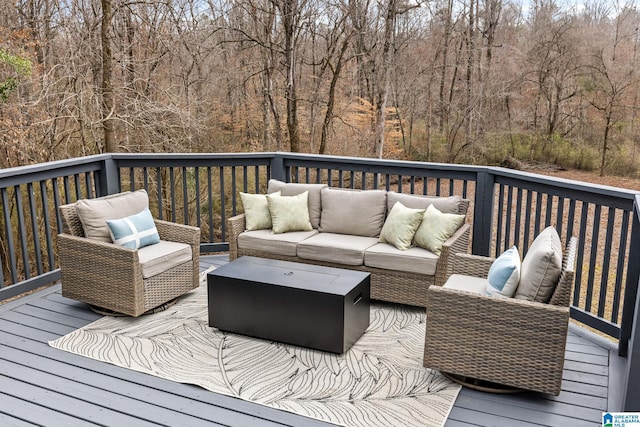 wooden terrace with outdoor lounge area