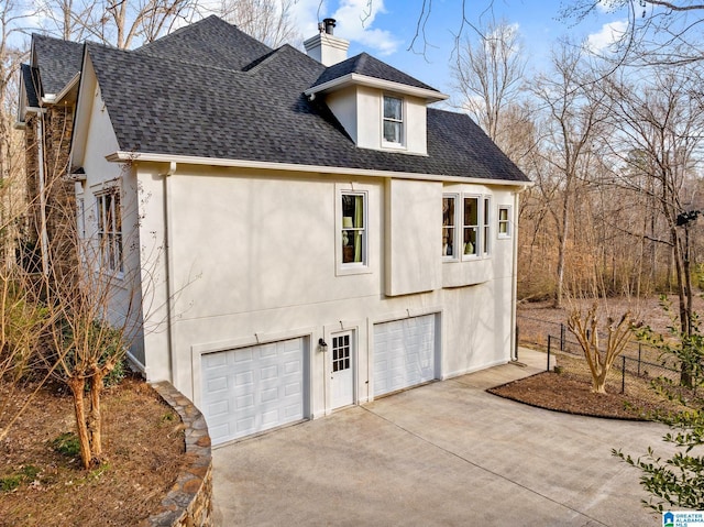 view of side of home with a garage