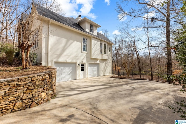 view of home's exterior with a garage