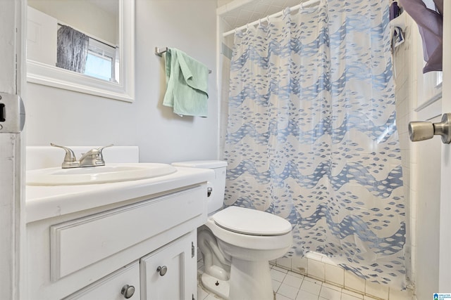 bathroom with vanity, a shower with curtain, tile patterned floors, and toilet