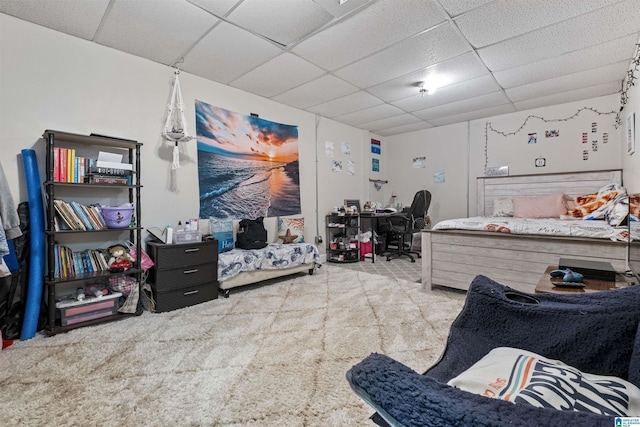 carpeted bedroom featuring a paneled ceiling